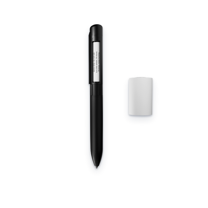 SneakPen Solo with its reading window open, next to a paper roll